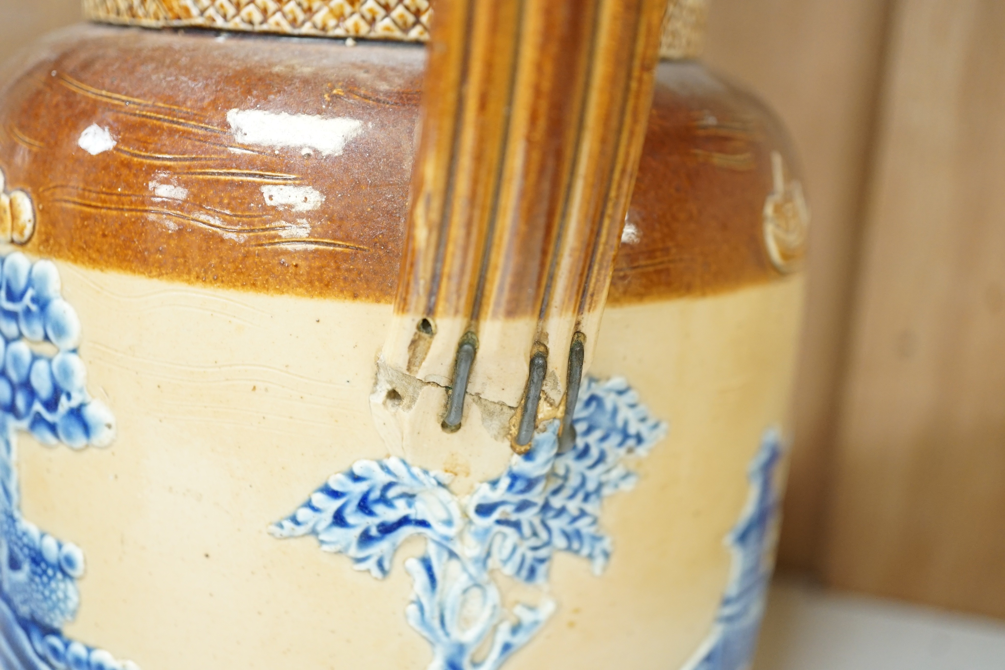 A Victorian solid agate ware pottery jug, a similar bowl and pair of miniature jugs, an unusual Doulton Lambeth stoneware jug and a small relief-moulded teapot, Doulton jug, 19cms high